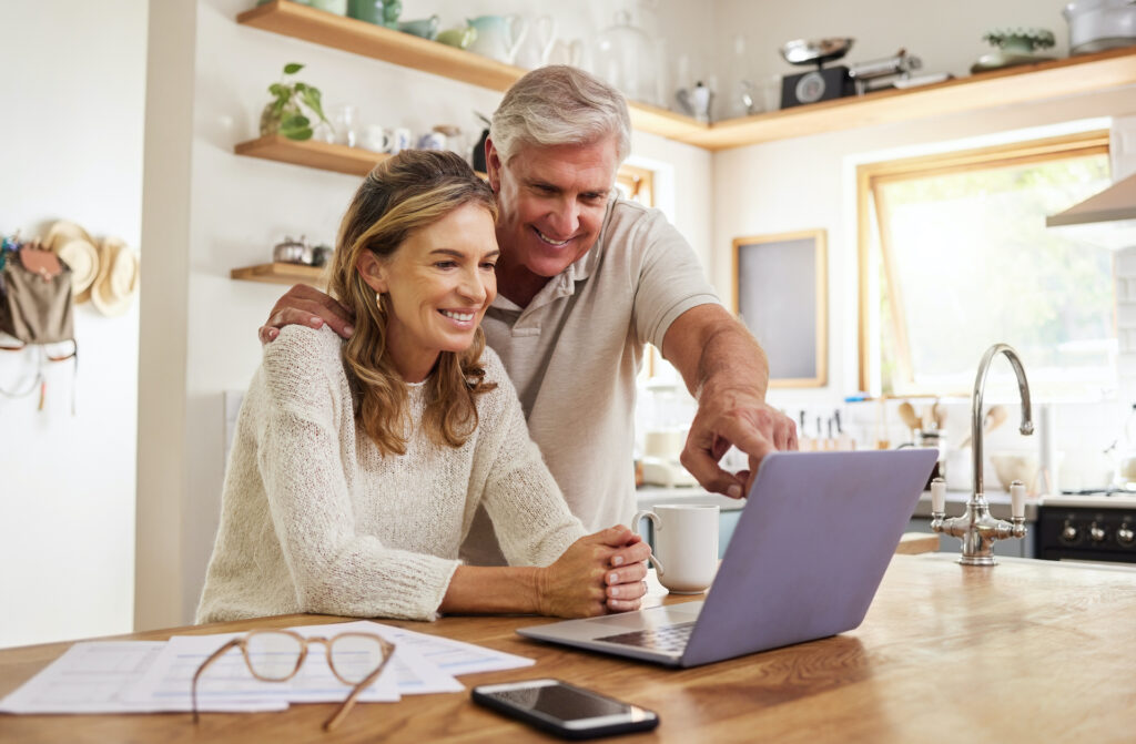 couple with laptop and paperwork